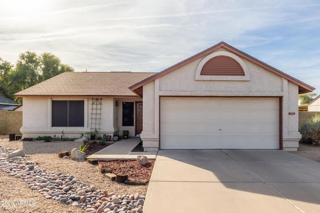 ranch-style home featuring a garage