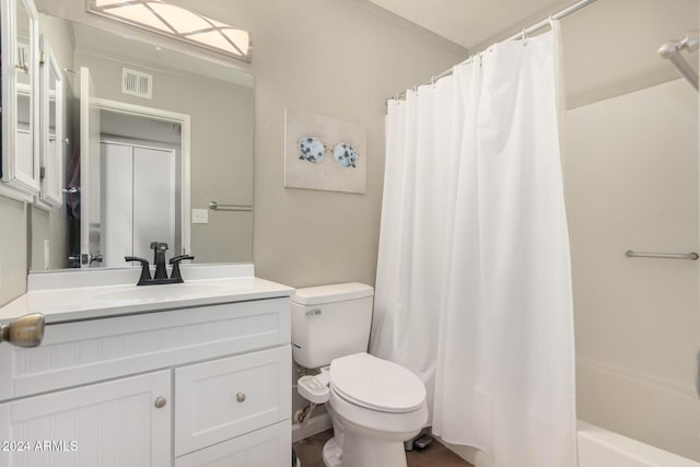 full bathroom with shower / tub combo with curtain, vanity, and toilet