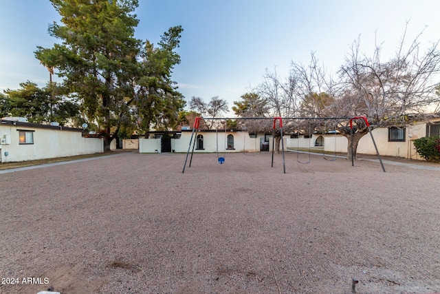 view of home's community with a playground