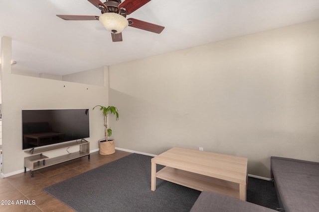 tiled living room featuring ceiling fan