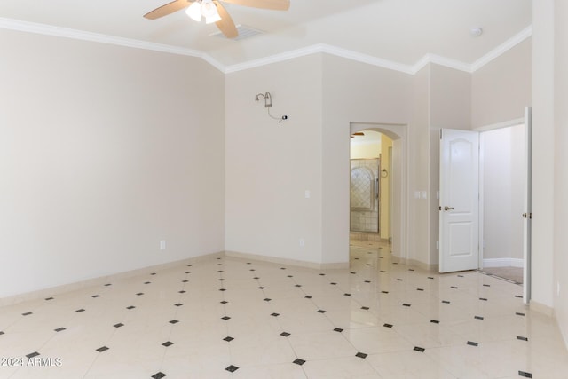 unfurnished room featuring arched walkways, crown molding, and ceiling fan