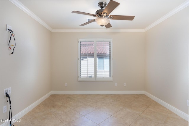 unfurnished room featuring baseboards, light tile patterned floors, ornamental molding, and a ceiling fan