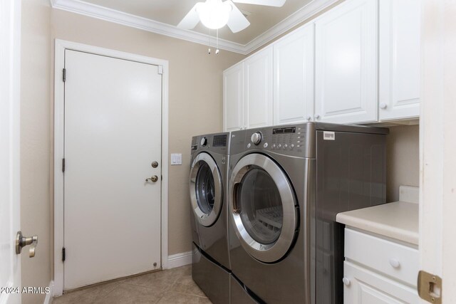 washroom with ornamental molding, separate washer and dryer, light tile patterned flooring, ceiling fan, and cabinet space