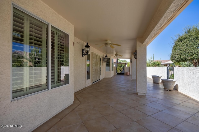 view of patio / terrace featuring a ceiling fan and fence