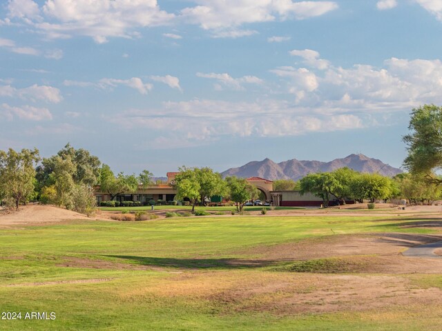 view of community featuring a mountain view and a lawn