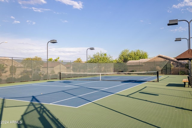 view of sport court featuring community basketball court and fence
