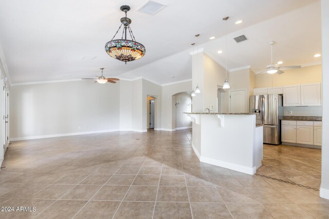 kitchen with stainless steel fridge, visible vents, and ceiling fan