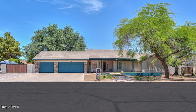 238 W Myrna Ln, Tempe, AZ 85284 - ranch-style house featuring a garage, concrete driveway, and stone siding