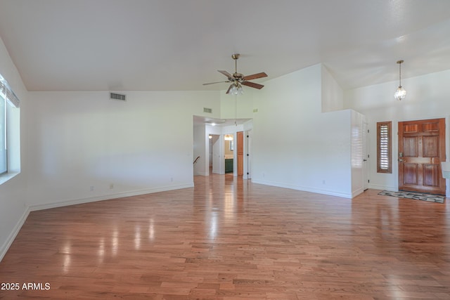 238 W Myrna Ln, Tempe, AZ 85284 - unfurnished living room with light wood-style floors, ceiling fan, and high vaulted ceiling