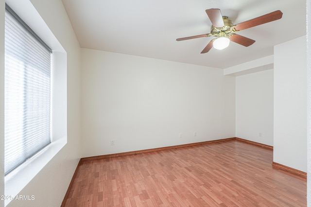 238 W Myrna Ln, Tempe, AZ 85284 - empty room featuring healthy amount of natural light, light wood-style flooring, and a ceiling fan