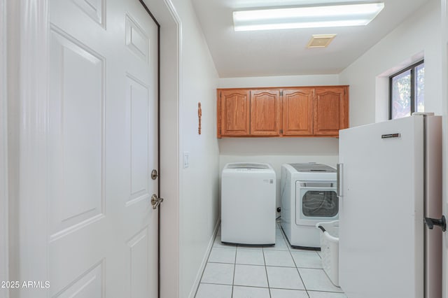 238 W Myrna Ln, Tempe, AZ 85284 - laundry room featuring cabinet space, washer and clothes dryer, and light tile patterned flooring
