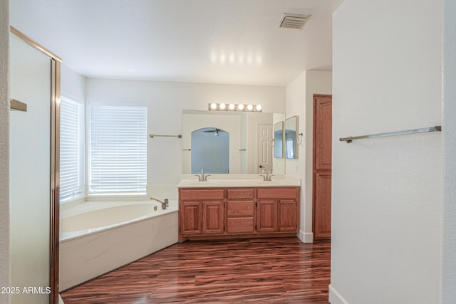 238 W Myrna Ln, Tempe, AZ 85284 - full bathroom with wood finished floors, double vanity, a garden tub, and healthy amount of natural light