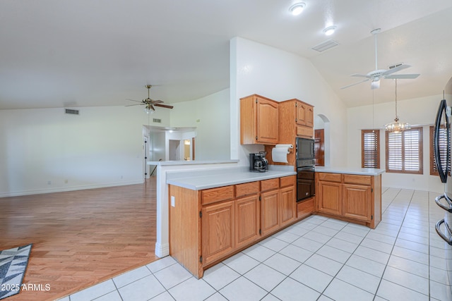 238 W Myrna Ln, Tempe, AZ 85284 - kitchen featuring a ceiling fan, a peninsula, light countertops, light tile patterned floors, and high vaulted ceiling
