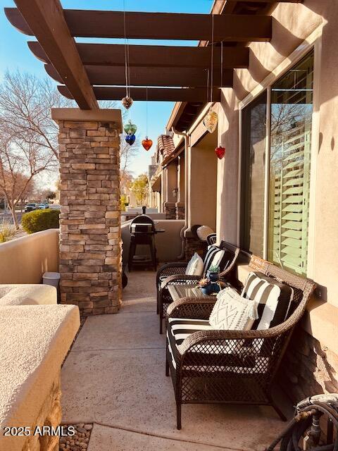 view of patio featuring a pergola