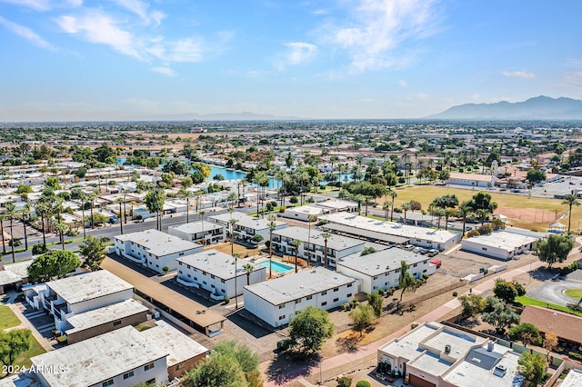 drone / aerial view with a water and mountain view