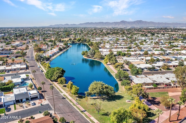 bird's eye view featuring a residential view and a water and mountain view