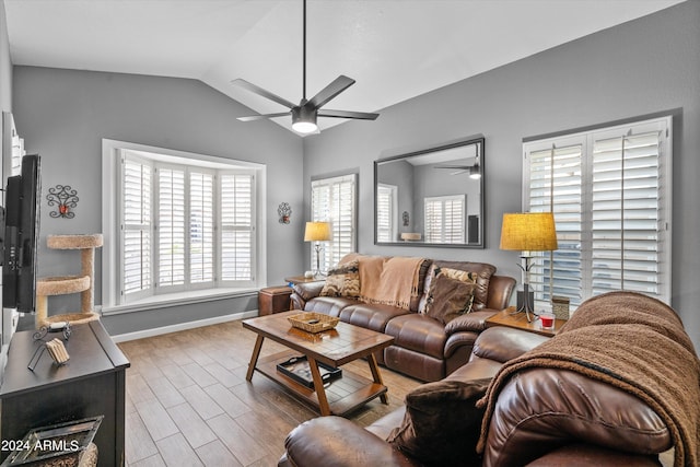 living room featuring hardwood / wood-style flooring, lofted ceiling, and ceiling fan