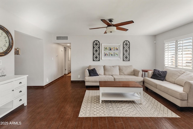 living room featuring ceiling fan and dark hardwood / wood-style flooring