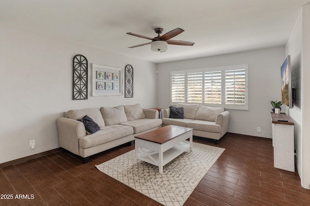 living room featuring dark wood-type flooring and ceiling fan