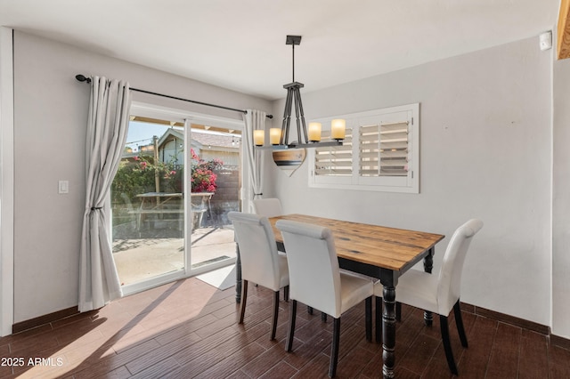 dining area featuring a chandelier