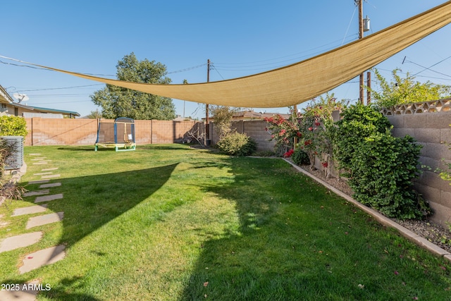 view of yard featuring a trampoline