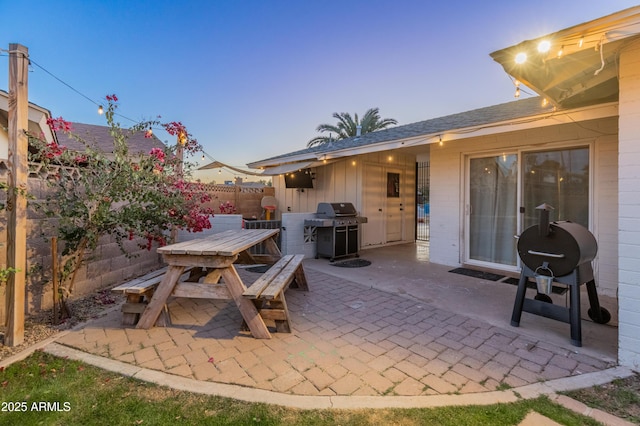 view of patio featuring a grill