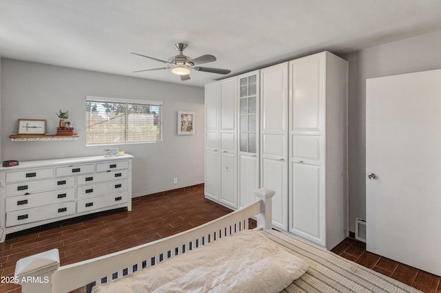 bedroom featuring ceiling fan and a closet