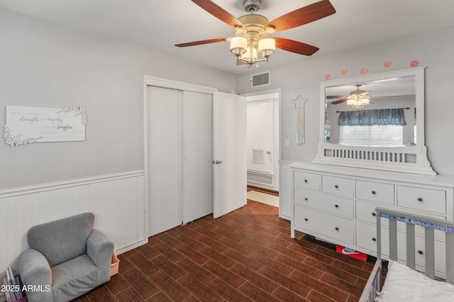 bedroom with ceiling fan and a closet