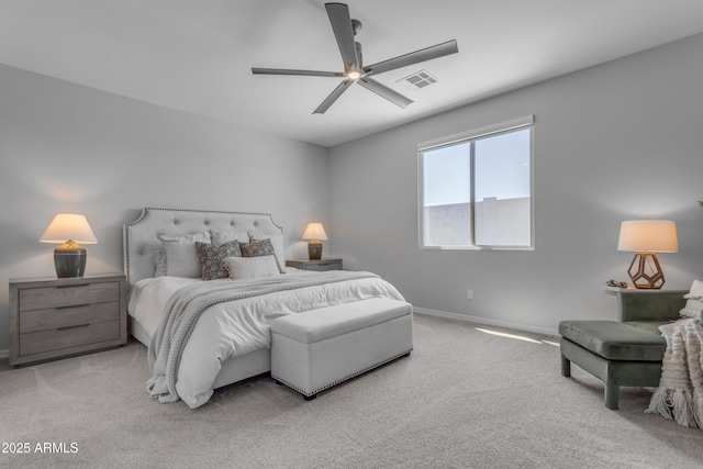 carpeted bedroom featuring a ceiling fan, baseboards, and visible vents