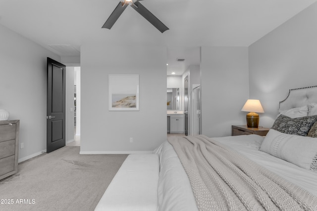 bedroom featuring ceiling fan, visible vents, carpet floors, baseboards, and ensuite bath