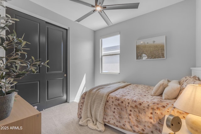 bedroom with a ceiling fan and carpet