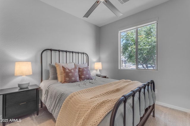 bedroom with baseboards, ceiling fan, and carpet