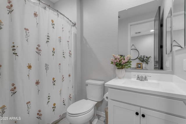 bathroom featuring vanity, visible vents, toilet, baseboards, and a shower with curtain