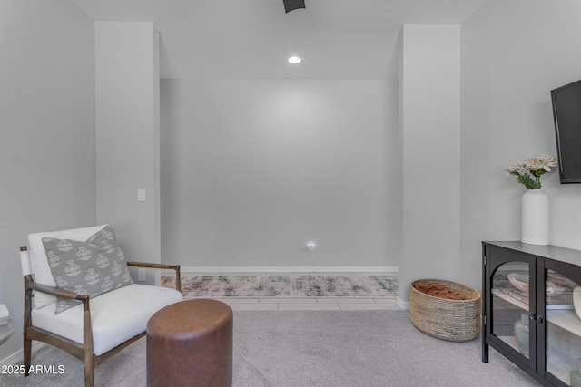 sitting room with tile patterned floors and baseboards