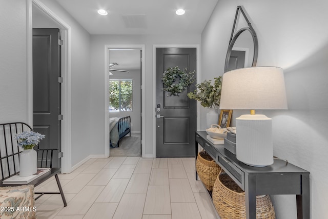 foyer featuring recessed lighting, baseboards, and visible vents