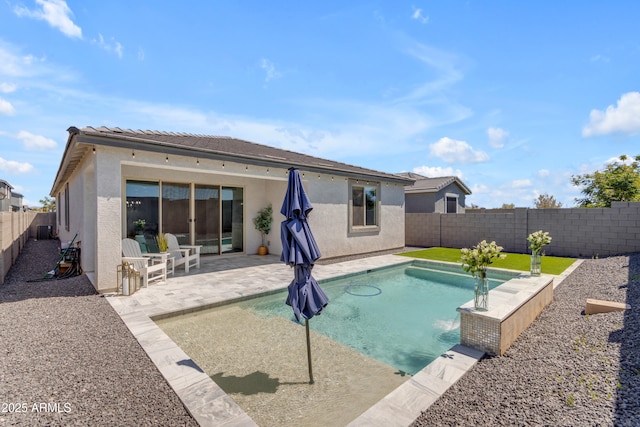 view of pool with a fenced in pool, a fenced backyard, and a patio