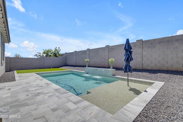 view of pool with a fenced in pool, a fenced backyard, and a patio area