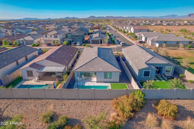 bird's eye view featuring a mountain view and a residential view