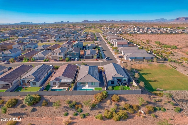 birds eye view of property with a mountain view and a residential view