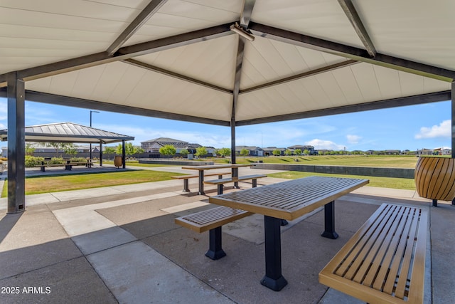 view of community featuring a yard, a gazebo, and a residential view