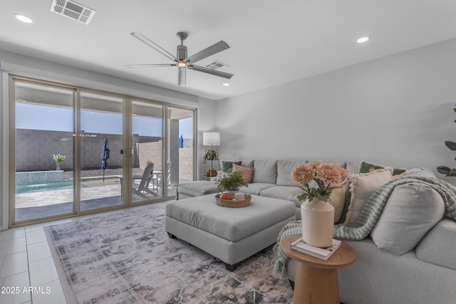 tiled living room with ceiling fan, recessed lighting, and visible vents