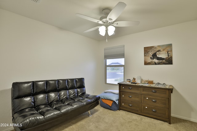 living room featuring ceiling fan and light carpet