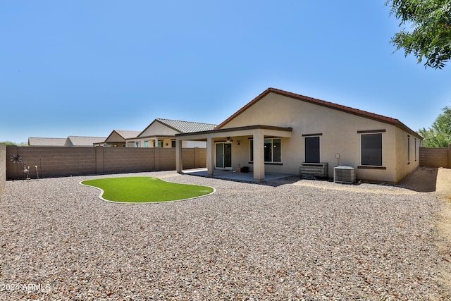 rear view of house with a patio area and central air condition unit