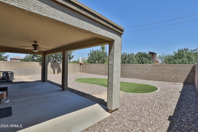 exterior space featuring central AC unit and ceiling fan