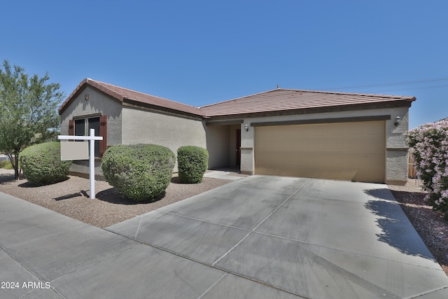 ranch-style home featuring a garage