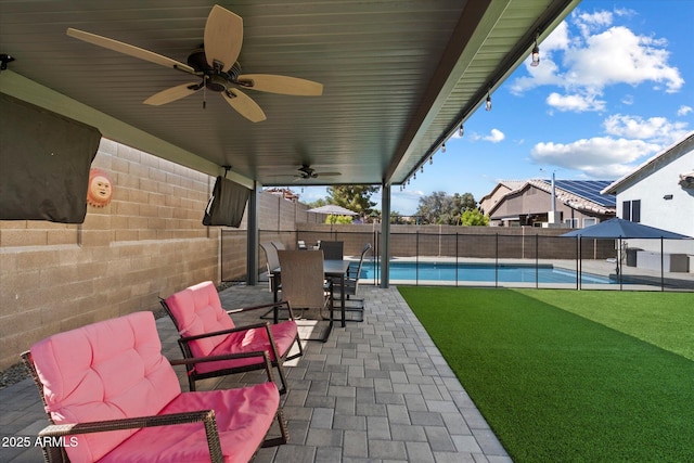 19002 N 25th Pl, Phoenix, AZ 85050 - fenced backyard featuring a ceiling fan, a patio area, and outdoor dining area