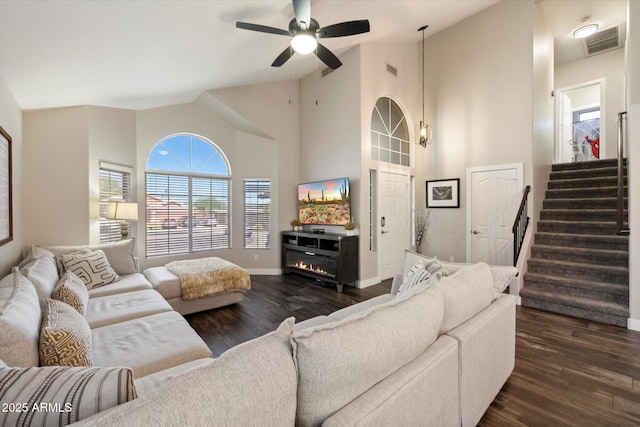 19002 N 25th Pl, Phoenix, AZ 85050 - living room featuring dark wood-style flooring, a ceiling fan, stairs, and high vaulted ceiling