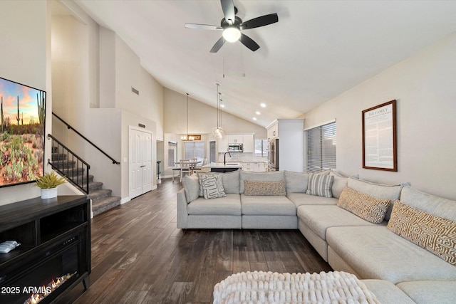 19002 N 25th Pl, Phoenix, AZ 85050 - living area featuring vaulted ceiling, stairs, ceiling fan, dark wood-style floors, and recessed lighting