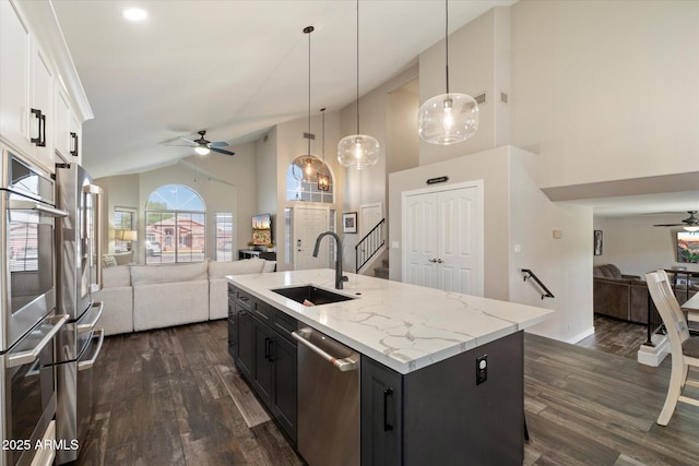 19002 N 25th Pl, Phoenix, AZ 85050 - kitchen featuring a ceiling fan, open floor plan, stainless steel appliances, high vaulted ceiling, and dark cabinets