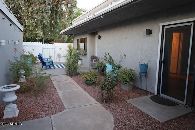8848 N New World Dr, Glendale, AZ 85302 - doorway to property featuring stucco siding and a patio area